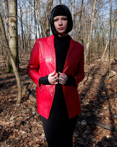 This vintage red leather jacket from the 80s is anything but outdated. With light shoulder pads to add structure, it's the statement piece!