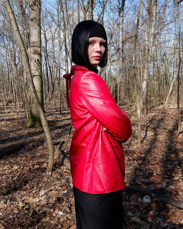 This vintage red leather jacket from the 80s is anything but outdated. With light shoulder pads to add structure, it's the statement piece!