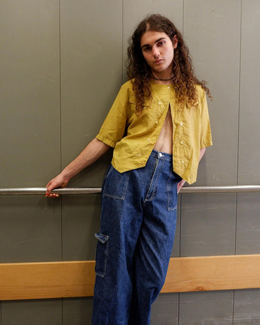 This Vintage 80s yellow short sleeve blouse is a double dose of 80s with its two rows of buttons and shoulder pads!