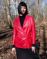 This vintage red leather jacket from the 80s is anything but outdated. With light shoulder pads to add structure, it's the statement piece!