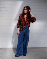 This Vintage 80s blouse is eccentric and elegant in all the right places! With its eye-catching crazy pattern and elastic hem, you'll be ready to go! So, if you're looking for something a little wild, this is the one for you! Please keep in mind, that the sleeves are shorter than usual.