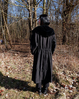 Add some edge to your wardrobe with this Vintage 80s/90s wool coat. The dark grey/black color combination and velvet hood give off a grunge vibe!