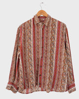 Unlock your inner 70s child with this groovy vintage blouse! Featuring an all-over 70s pattern on soft viscose fabric, this comfy top is perfect for adding a little retro flair to your wardrobe. Sassy yet subtle, you'll be feeling the 70s vintage power in no time!