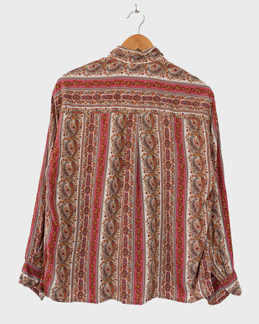Unlock your inner 70s child with this groovy vintage blouse! Featuring an all-over 70s pattern on soft viscose fabric, this comfy top is perfect for adding a little retro flair to your wardrobe. Sassy yet subtle, you'll be feeling the 70s vintage power in no time!