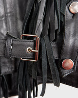 Add some wild vibes to your wardrobe with this vintage 80s 90s black fringe leather jacket. Complete with conchos and a belt, this jacket will be a statement piece for any outfit.