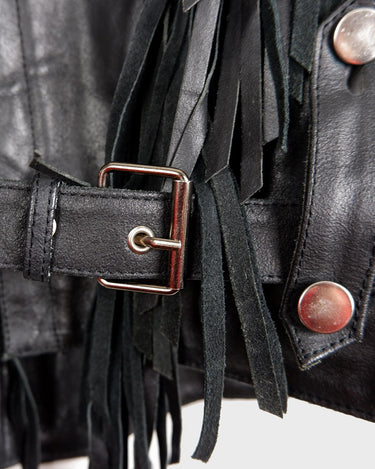 Add some wild vibes to your wardrobe with this vintage 80s 90s black fringe leather jacket. Complete with conchos and a belt, this jacket will be a statement piece for any outfit.