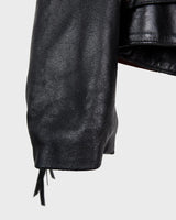 Add some wild vibes to your wardrobe with this vintage 80s 90s black fringe leather jacket. Complete with conchos and a belt, this jacket will be a statement piece for any outfit.
