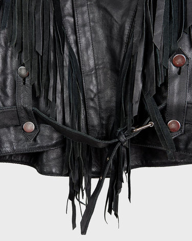 Add some wild vibes to your wardrobe with this vintage 80s 90s black fringe leather jacket. Complete with conchos and a belt, this jacket will be a statement piece for any outfit.