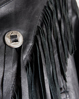Add some wild vibes to your wardrobe with this vintage 80s 90s black fringe leather jacket. Complete with conchos and a belt, this jacket will be a statement piece for any outfit.
