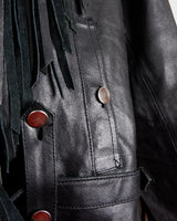 Add some wild vibes to your wardrobe with this vintage 80s 90s black fringe leather jacket. Complete with conchos and a belt, this jacket will be a statement piece for any outfit.