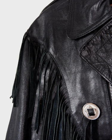 Add some wild vibes to your wardrobe with this vintage 80s 90s black fringe leather jacket. Complete with conchos and a belt, this jacket will be a statement piece for any outfit.