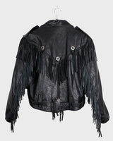 Add some wild vibes to your wardrobe with this vintage 80s 90s black fringe leather jacket. Complete with conchos and a belt, this jacket will be a statement piece for any outfit.