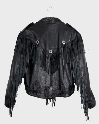 Add some wild vibes to your wardrobe with this vintage 80s 90s black fringe leather jacket. Complete with conchos and a belt, this jacket will be a statement piece for any outfit.