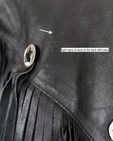 Add some wild vibes to your wardrobe with this vintage 80s 90s black fringe leather jacket. Complete with conchos and a belt, this jacket will be a statement piece for any outfit.