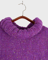 Introducing this handmade purple long turtlekneck slipover! The colorful melange design adds a playful twist to this cozy XS-S fit, perfect for layering.