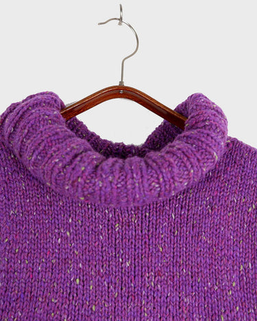 Introducing this handmade purple long turtlekneck slipover! The colorful melange design adds a playful twist to this cozy XS-S fit, perfect for layering.