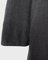Add some edge to your wardrobe with this Vintage 80s/90s wool coat. The dark grey/black color combination and velvet hood give off a grunge vibe!