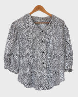 It's shimmery, it's polka-dotted, and it's totally 80s! Add a little pizzaz to your wardrobe with this classic 80s vintage blouse.