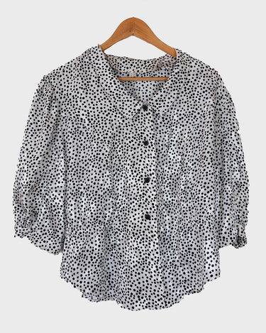 It's shimmery, it's polka-dotted, and it's totally 80s! Add a little pizzaz to your wardrobe with this classic 80s vintage blouse.