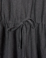 Add some edge to your wardrobe with this Vintage 80s/90s wool coat. The dark grey/black color combination and velvet hood give off a grunge vibe!