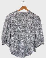 It's shimmery, it's polka-dotted, and it's totally 80s! Add a little pizzaz to your wardrobe with this classic 80s vintage blouse.