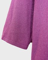 Sprinkle some sparkle into your wardrobe with this Y2k Laura Ashley pink glitter shirt! The 3/4 sleeves make it versatile for any occasion. This shirt is perfect for those who love a little extra shine in their outfits!