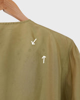 Who says shoulder pads are a thing of the past? Take a walk on the wild side and grab this vintage 80s golden (light greenish undertone) silk blouse with confidence!