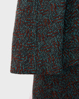 Experience true vintage elegance with this stunning green wool coat from the 70s/80s. Beautiful brown accents add a stylish touch, while the real fur collar adds a luxurious and statement-making element.