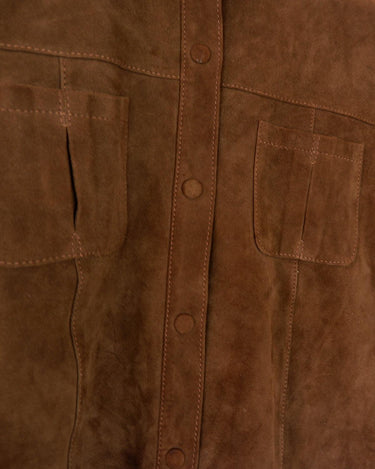 Experience the smoothness with this Vintage 90s classy brown faux suede leather shirt! Carefully crafted with velvety soft faux suede leather fabric, this piece adds a timeless touch of the 90s to any outfit. The press studs complete the look, making you a true smooth operator!
