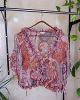 Feel like a fairy in this Vintage 90s pink-multicolor transparent volant silk mix blouse! With its deep V collar and light shimmer, this blouse is like a fairy tale. Perfect for adding some magical vibes to your wardrobe.