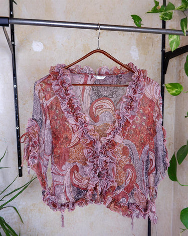 Feel like a fairy in this Vintage 90s pink-multicolor transparent volant silk mix blouse! With its deep V collar and light shimmer, this blouse is like a fairy tale. Perfect for adding some magical vibes to your wardrobe.