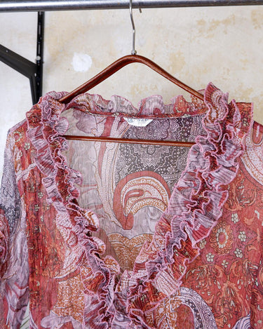 Feel like a fairy in this Vintage 90s pink-multicolor transparent volant silk mix blouse! With its deep V collar and light shimmer, this blouse is like a fairy tale. Perfect for adding some magical vibes to your wardrobe.