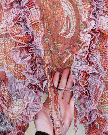 Feel like a fairy in this Vintage 90s pink-multicolor transparent volant silk mix blouse! With its deep V collar and light shimmer, this blouse is like a fairy tale. Perfect for adding some magical vibes to your wardrobe.