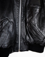 This iconic Vintage 80s black bomber leather jacket brings the edge with a serious dose of attitude! Boasting shoulder pads and a classic bomber jacket silhouette, it's sure to unleash your inner wild child!
