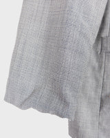 Give your wardrobe an edge with this grey spring double row buttons blazer from the 80s! With subtle yet stylish shoulder pads and a thin design, this blazer will add a touch of timeless vintage charm to any outfit.