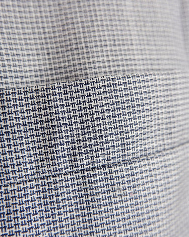 Give your wardrobe an edge with this grey spring double row buttons blazer from the 80s! With subtle yet stylish shoulder pads and a thin design, this blazer will add a touch of timeless vintage charm to any outfit.