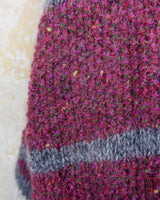 Add a pop of pink to your wardrobe with our vintage 80s wool sweater, featuring a geometric pattern.