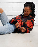 This vintage 80s velvet x silk blouse is having a moment! Its flowy and lightweight transparent fabric, coupled with its stunning red floral pattern, make it a must-have!