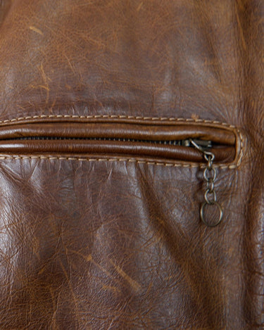 Fall in love with this italian vintage 80s brown leather jacket! With its classic look, warm wool lining, and thick leather material, you'll look and feel great while staying cozy!