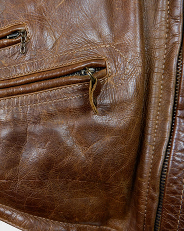 Fall in love with this italian vintage 80s brown leather jacket! With its classic look, warm wool lining, and thick leather material, you'll look and feel great while staying cozy!