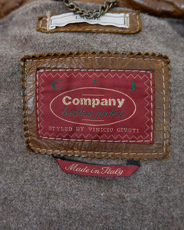 Fall in love with this italian vintage 80s brown leather jacket! With its classic look, warm wool lining, and thick leather material, you'll look and feel great while staying cozy!