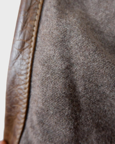 Fall in love with this italian vintage 80s brown leather jacket! With its classic look, warm wool lining, and thick leather material, you'll look and feel great while staying cozy!