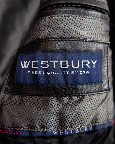 Add some edge to your wardrobe with this must-have preloved Westbury black leather coat. Perfect for cooler weather, this stylish piece will take any outfit to the next level!