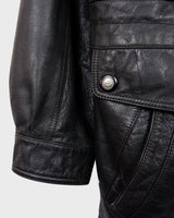 Add some edge to your wardrobe with this must-have preloved Westbury black leather coat. Perfect for cooler weather, this stylish piece will take any outfit to the next level!