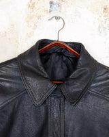 Introducing this Vintage 80s black fireman clasp leather coat, a must-have piece for your collection. Made of buttery soft leather, this coat exudes a cool and edgy vibe.