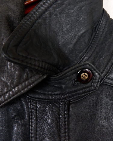 Introducing this Vintage 80s black fireman clasp leather coat, a must-have piece for your collection. Made of buttery soft leather, this coat exudes a cool and edgy vibe.