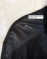 Introducing this Vintage 80s black fireman clasp leather coat, a must-have piece for your collection. Made of buttery soft leather, this coat exudes a cool and edgy vibe.