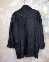 Introducing this Vintage 80s black fireman clasp leather coat, a must-have piece for your collection. Made of buttery soft leather, this coat exudes a cool and edgy vibe.