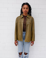 This Valentino jacket brings the class and the finest green leather, all wrapped up in one slick package! The only catch? No working zip (check out the last two photos to get the full scoop)! But don't let a defected zipper keep you from rocking the look!