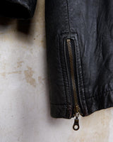 Introducing this Vintage 80s black fireman clasp leather coat, a must-have piece for your collection. Made of buttery soft leather, this coat exudes a cool and edgy vibe.